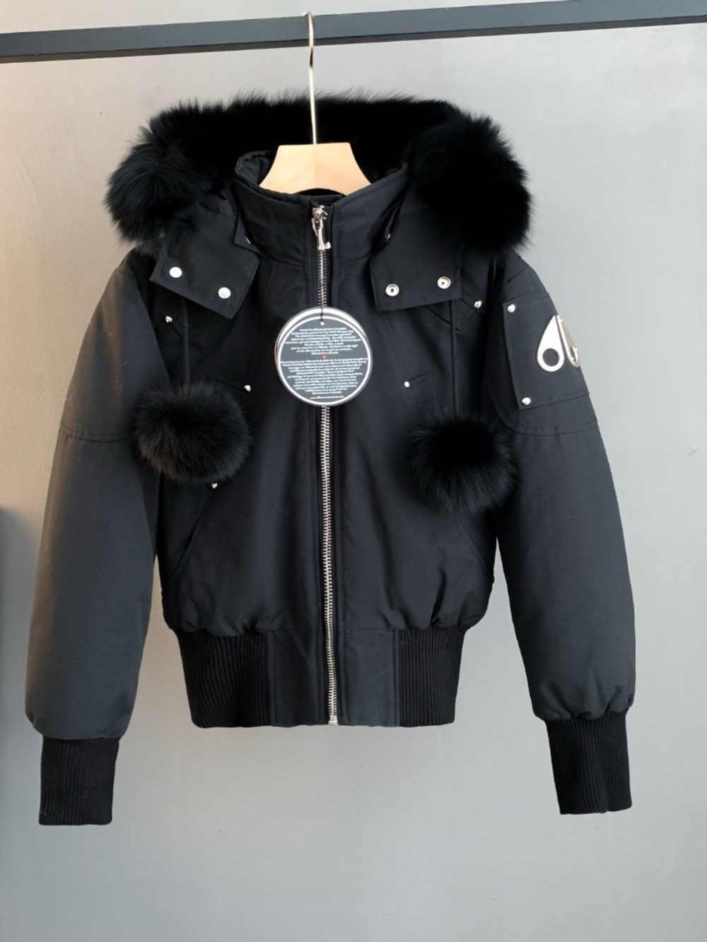 Moose Knuckles Women's Black Ski Bomber Jacket with Fur Pom Trims